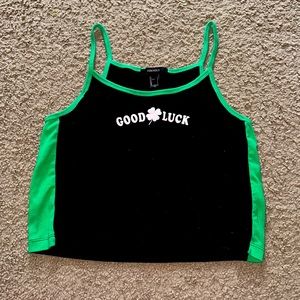 Cropped Irish Tank Top in Black and Green with a "Good Luck" Graphic Design.